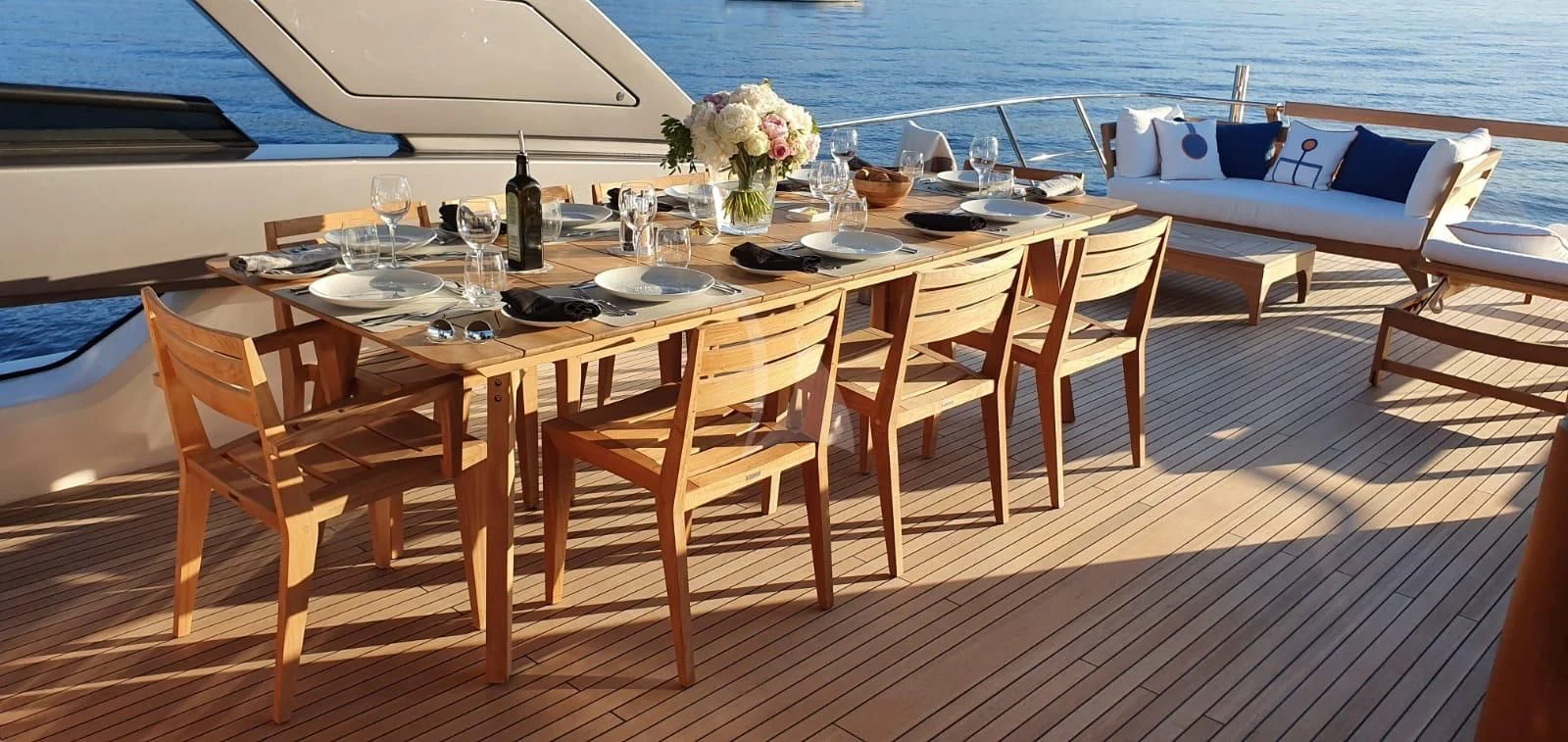 a table with chairs on it aboard REINE D'AZUR Yacht for Sale