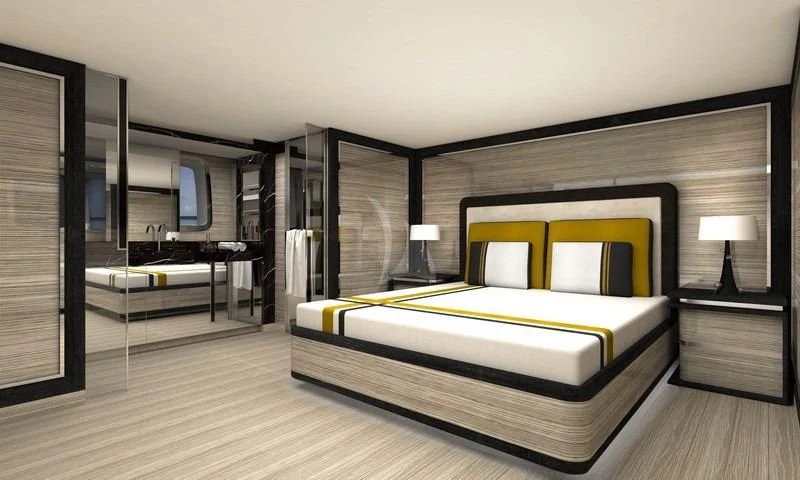 a bedroom with a bed and a desk aboard REINE D'AZUR Yacht for Sale
