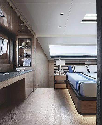 a room with a bed and a desk aboard REINE D'AZUR Yacht for Sale