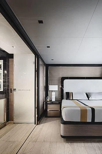 a bedroom with a bed and a closet aboard REINE D'AZUR Yacht for Sale
