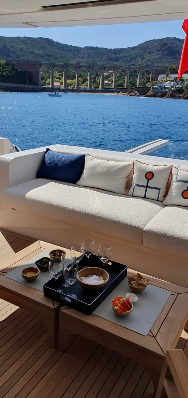 a table with a tray of food and glasses on it aboard REINE D'AZUR Yacht for Sale