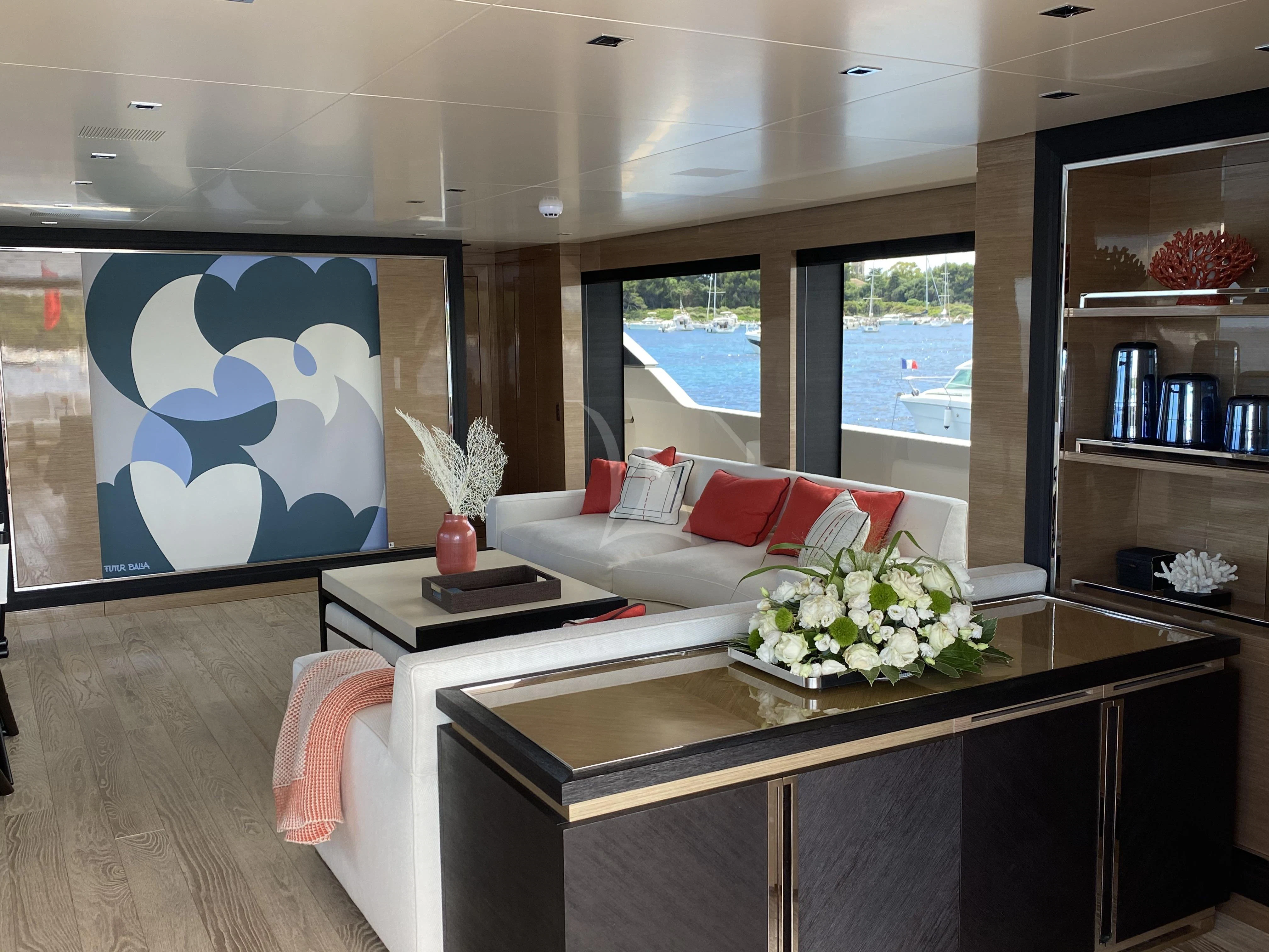 a living room with a large painting aboard REINE D'AZUR Yacht for Sale
