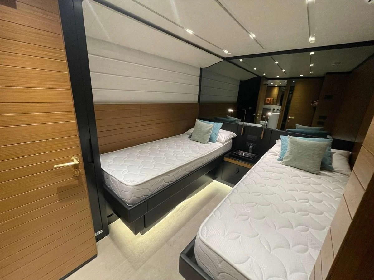 a room with two beds aboard REINE D'AZUR Yacht for Sale