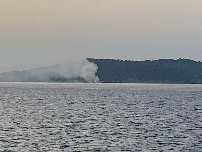 a large body of water with a large plume of smoke in the distance aboard REINE D'AZUR Yacht for Sale