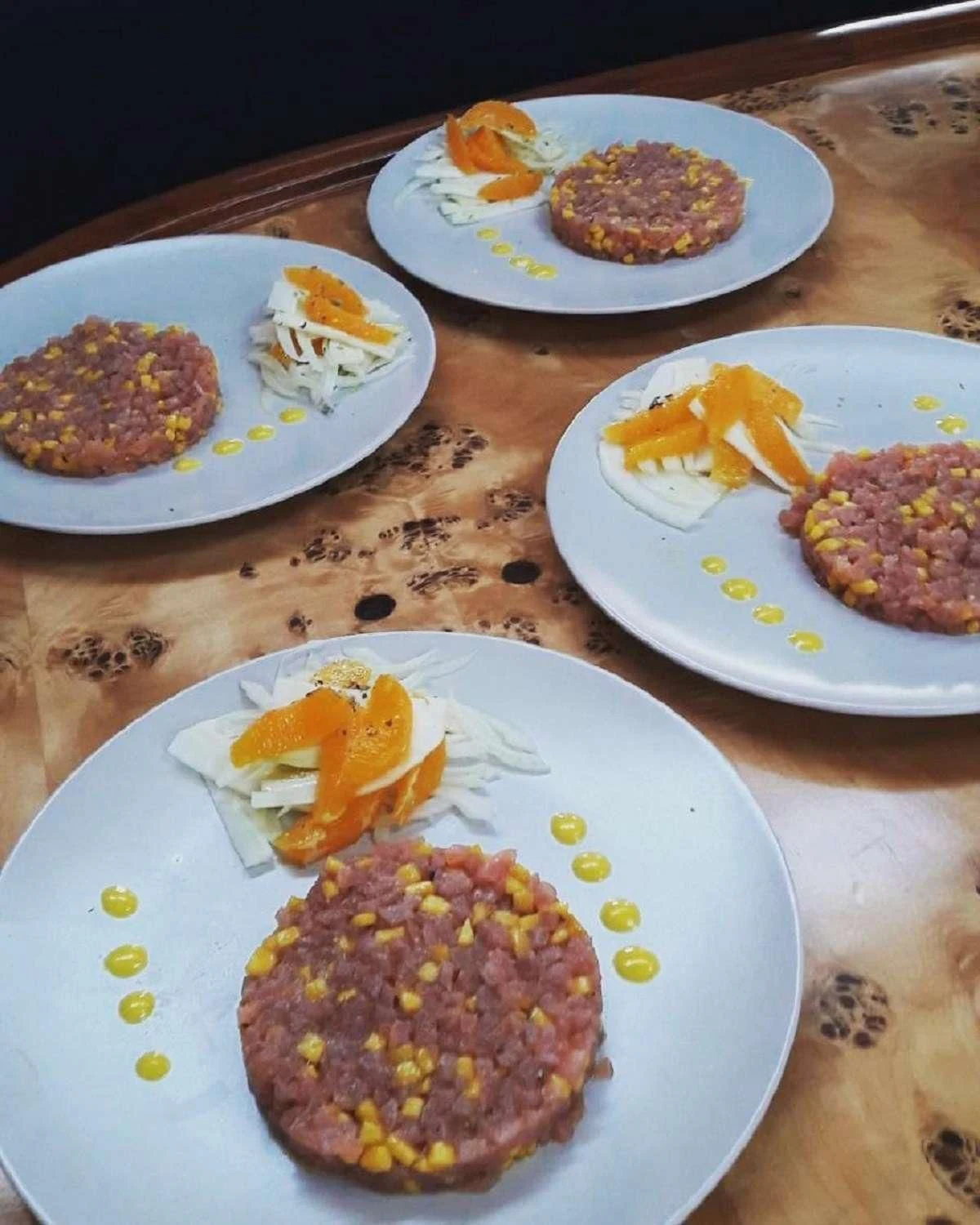 a table with plates of food aboard NOHEEA Yacht for Sale