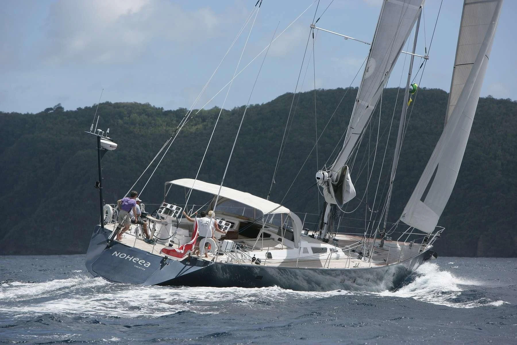 a boat sailing on the water aboard NOHEEA Yacht for Sale