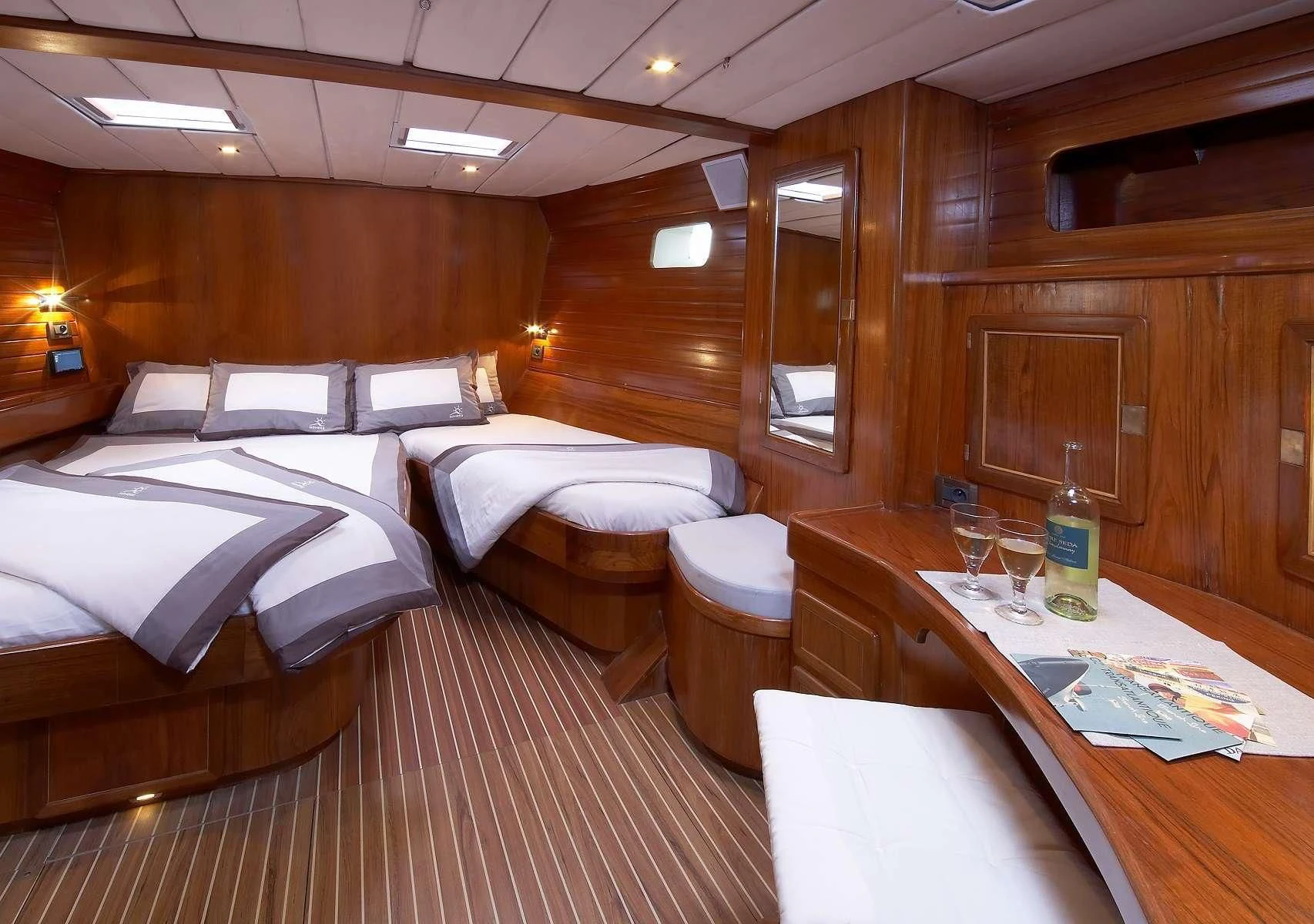 a room with a couple of beds aboard NOHEEA Yacht for Sale