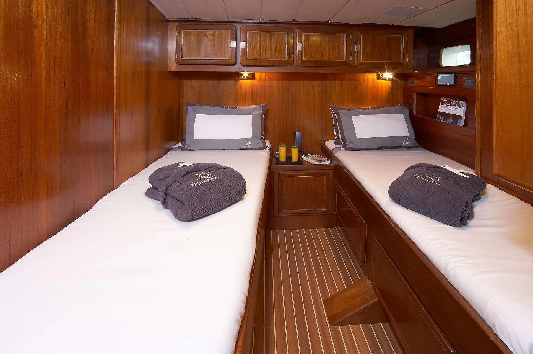 a room with a bed and a laptop on the bed aboard NOHEEA Yacht for Sale