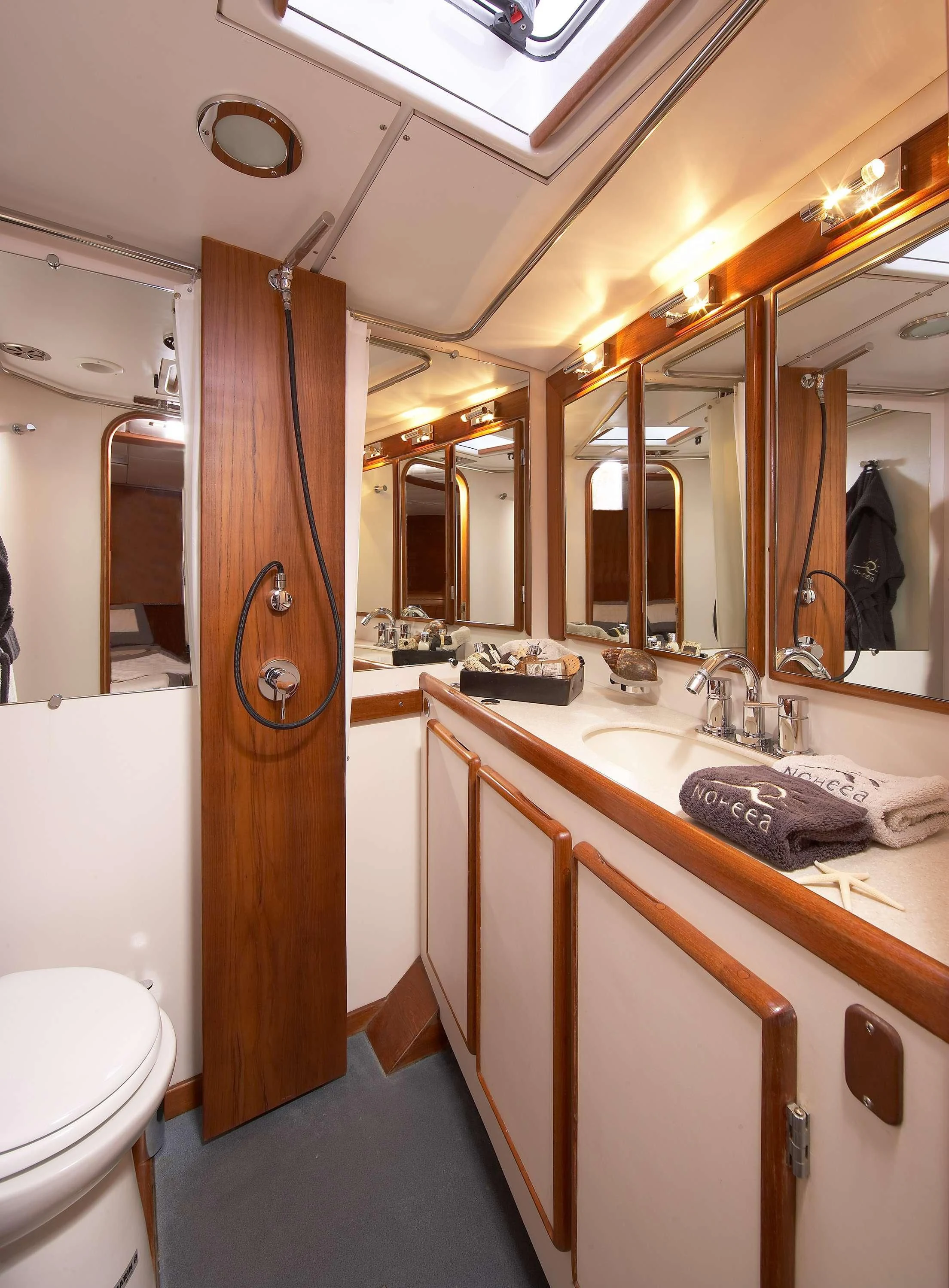 a bathroom with a sink and toilet aboard NOHEEA Yacht for Sale