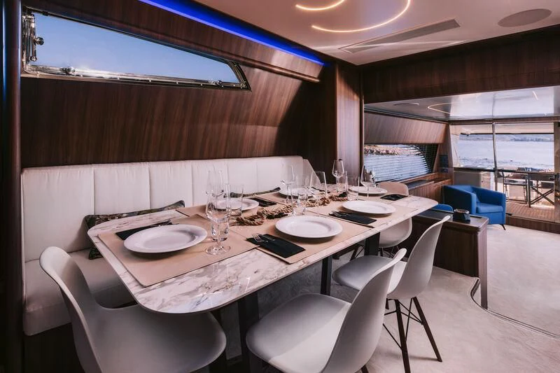 a table with plates and glasses on it aboard OXYGEN 8 Yacht for Charter