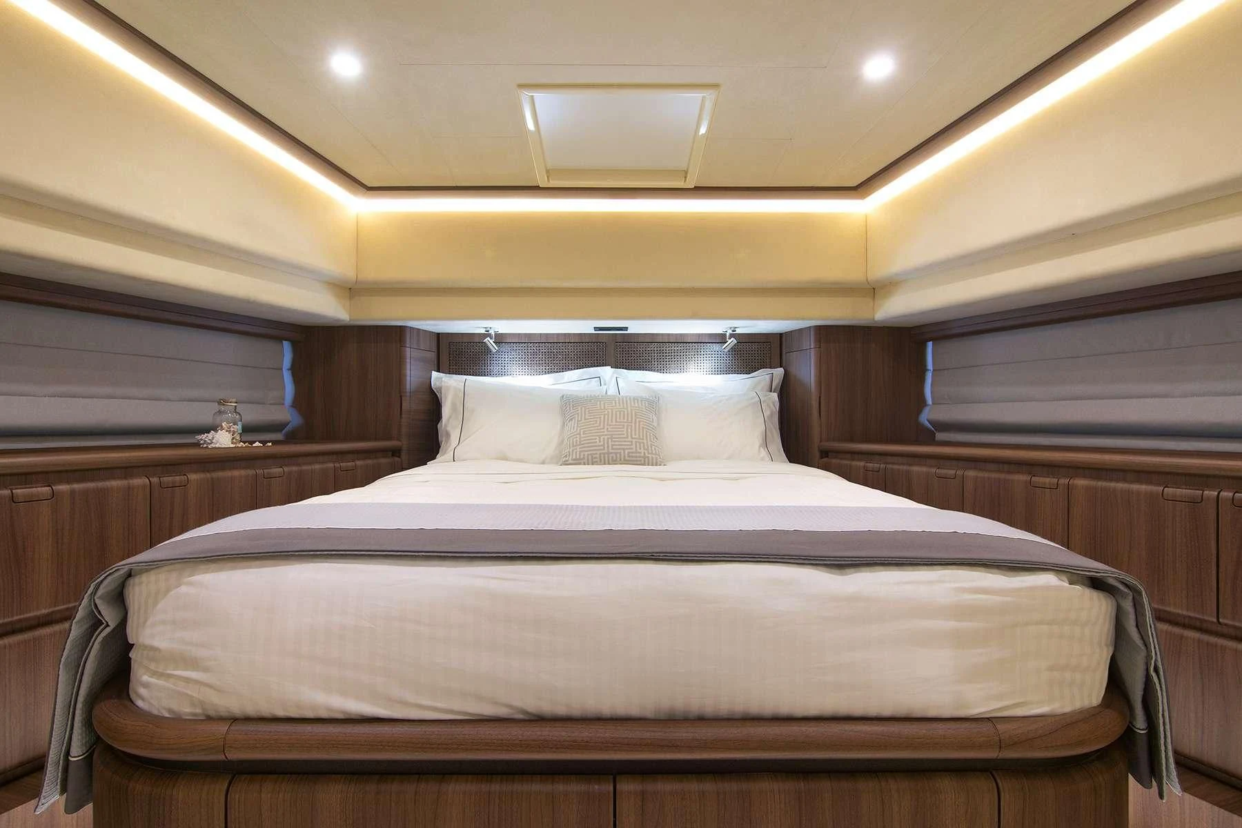 a bed with white sheets aboard OXYGEN 8 Yacht for Charter