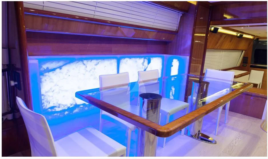 a table and chairs in a room aboard OXYGEN 8 Yacht for Charter