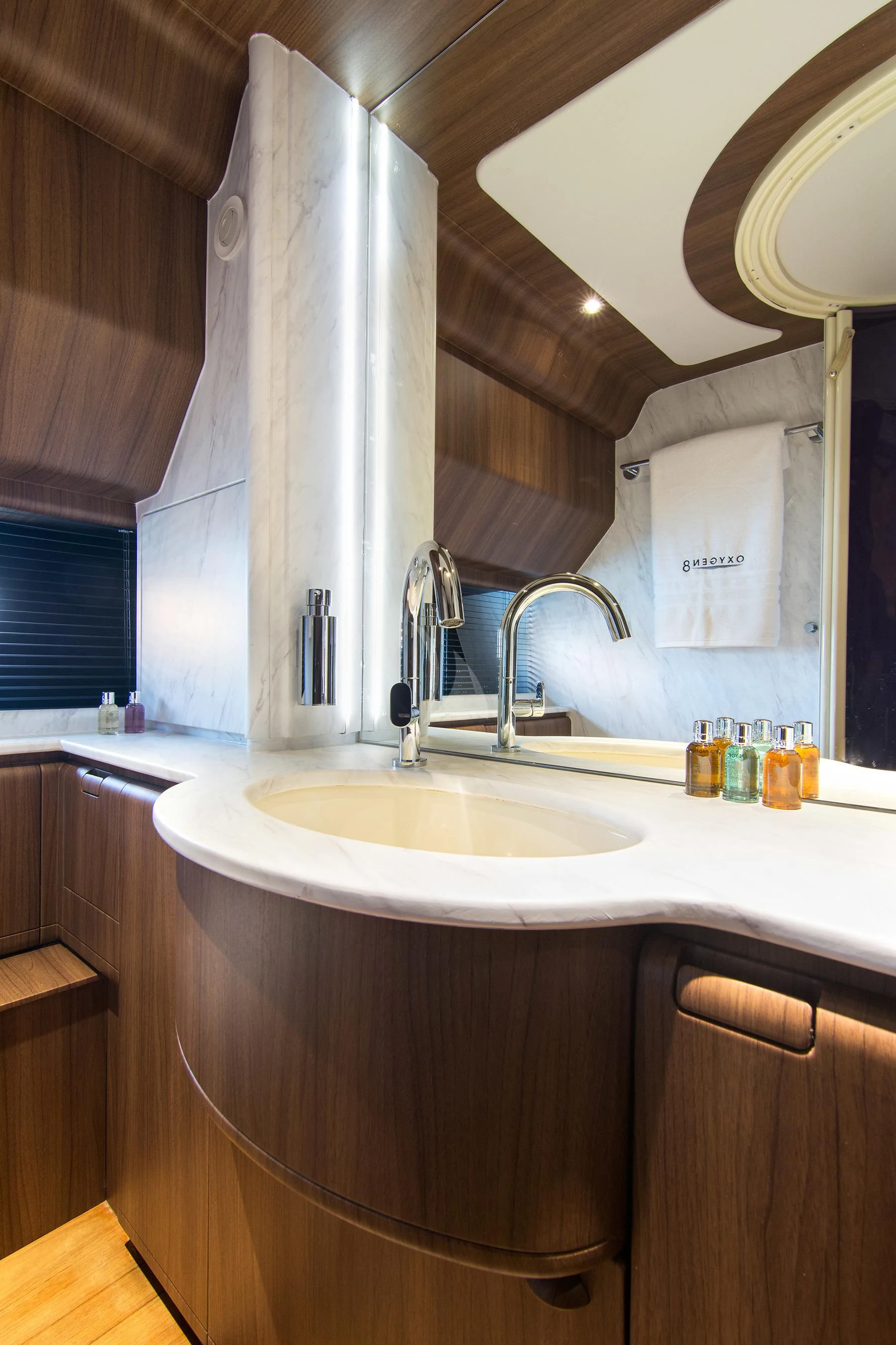 a bathroom with a sink and a mirror aboard OXYGEN 8 Yacht for Charter
