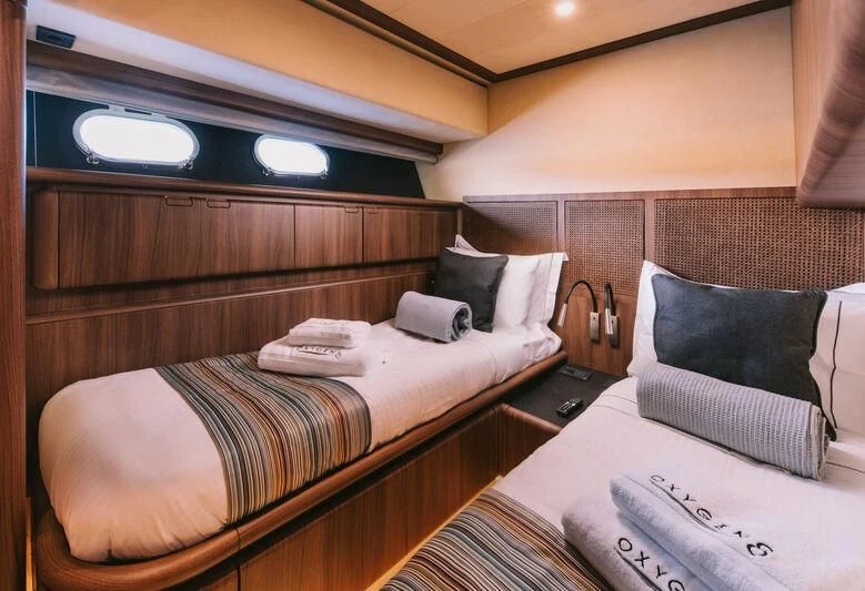 a couple of beds in a hotel room aboard OXYGEN 8 Yacht for Charter