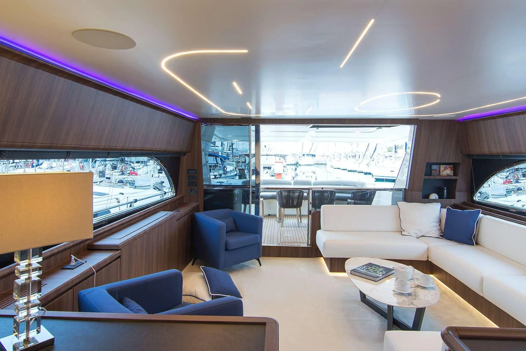 a living room with a large window aboard OXYGEN 8 Yacht for Charter