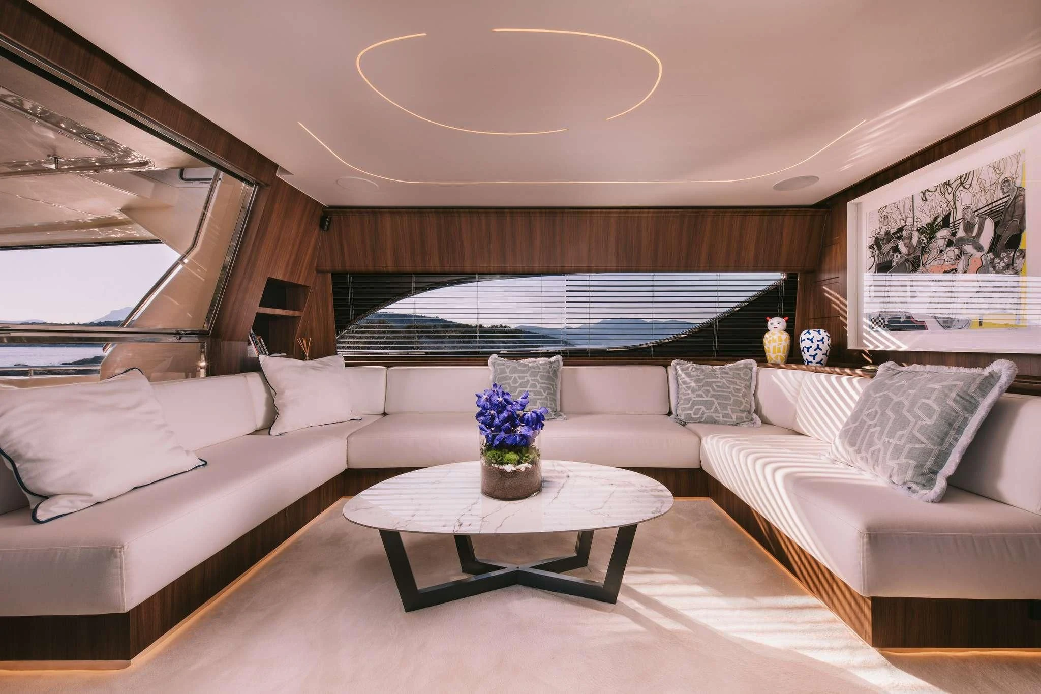 a living room with a large window aboard OXYGEN 8 Yacht for Charter