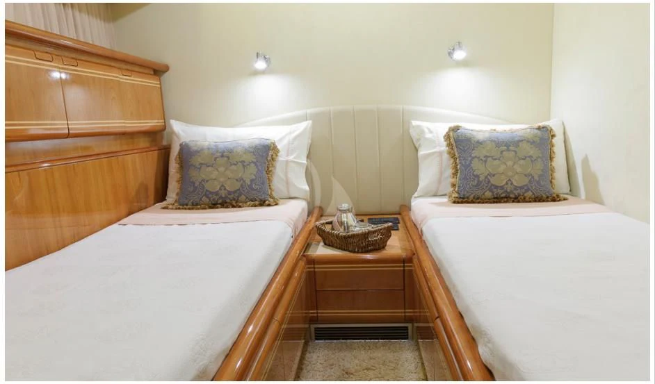 a couple of beds in a hotel room aboard OXYGEN 8 Yacht for Charter