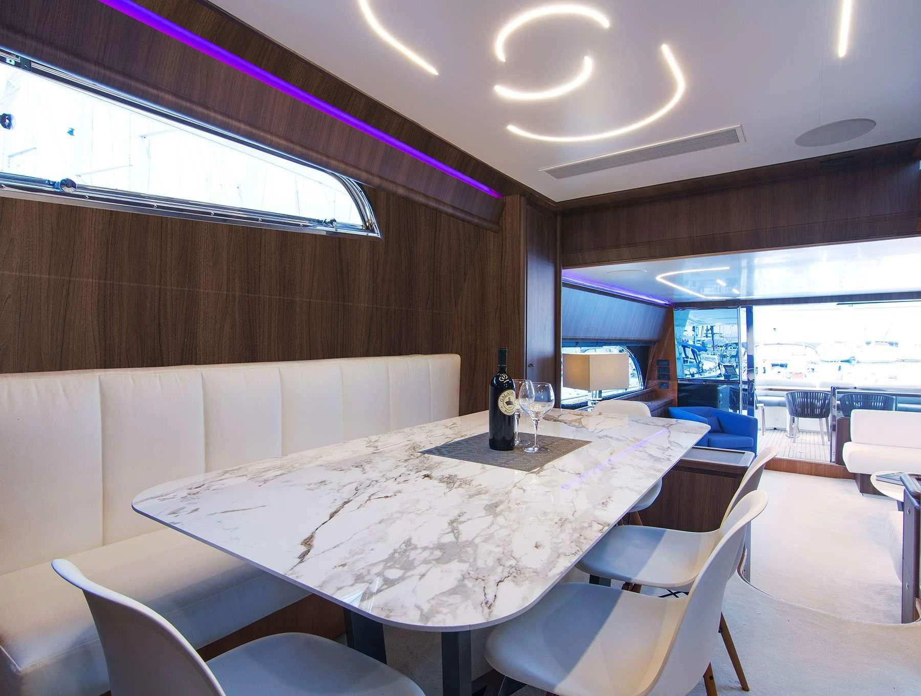 a room with tables and chairs aboard OXYGEN 8 Yacht for Charter
