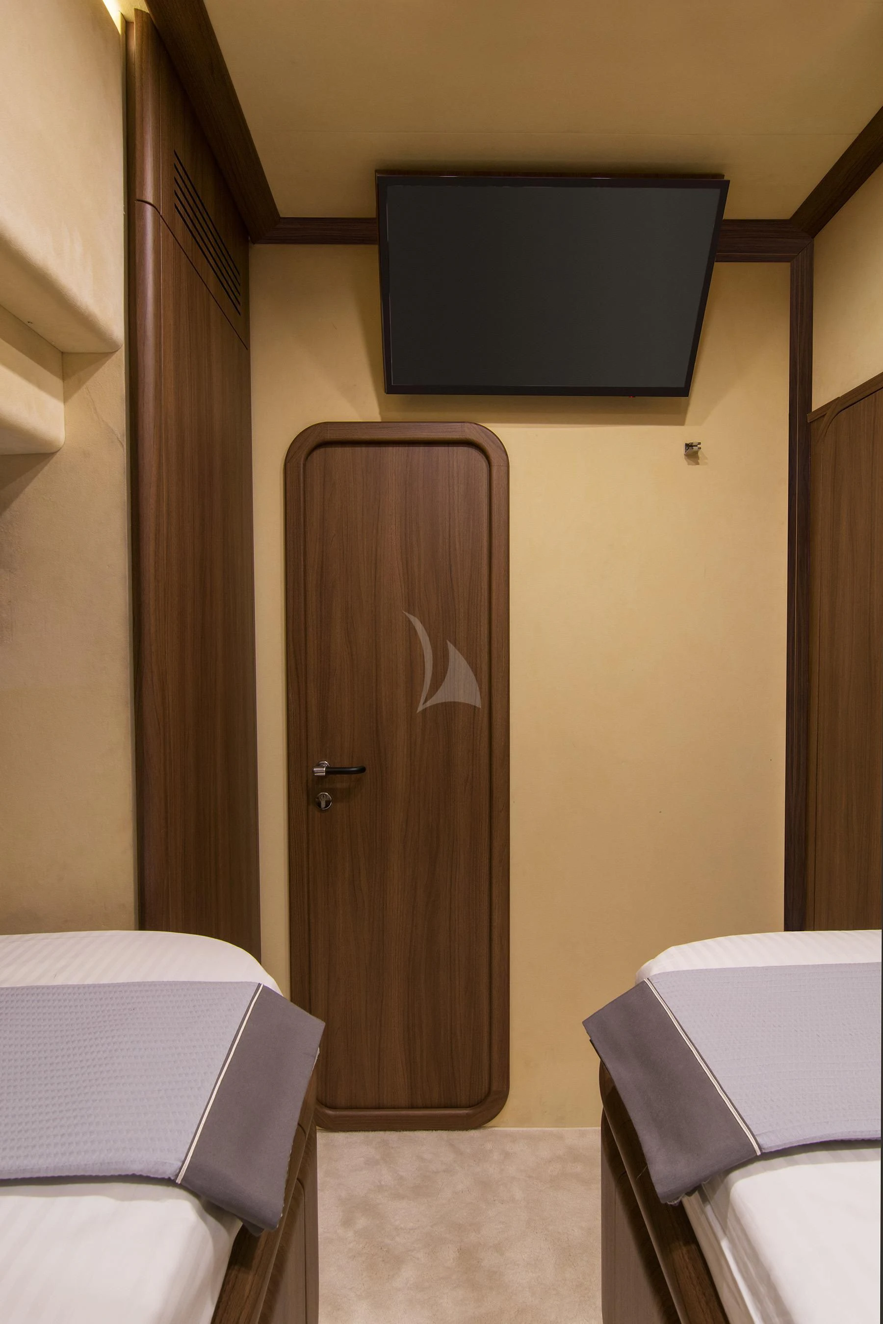 a room with a television and a bed aboard OXYGEN 8 Yacht for Charter