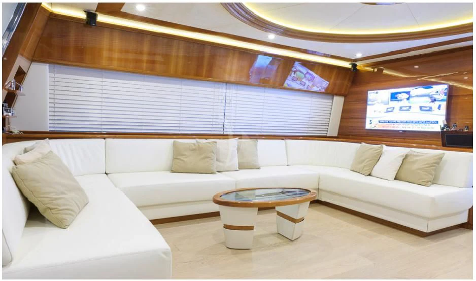 a room with a couch and a table aboard OXYGEN 8 Yacht for Charter