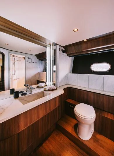 a bathroom with a toilet and a sink aboard OXYGEN 8 Yacht for Charter