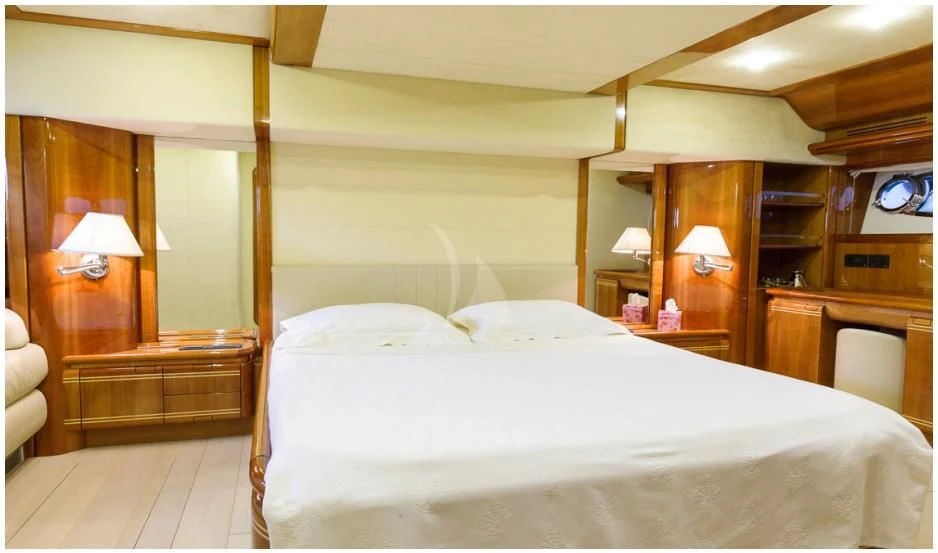 a bed with white sheets aboard OXYGEN 8 Yacht for Charter