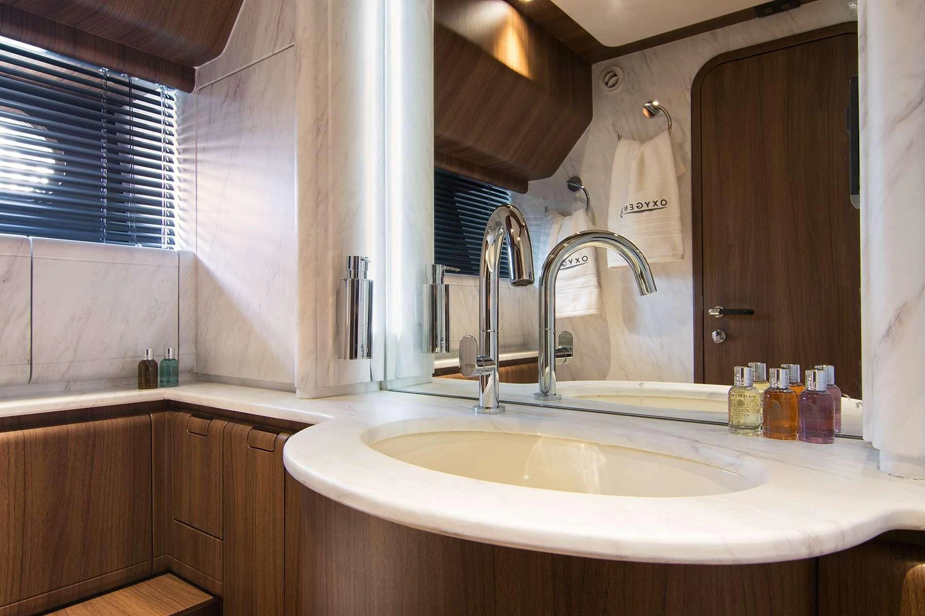 a bathroom with a sink and a mirror aboard OXYGEN 8 Yacht for Charter
