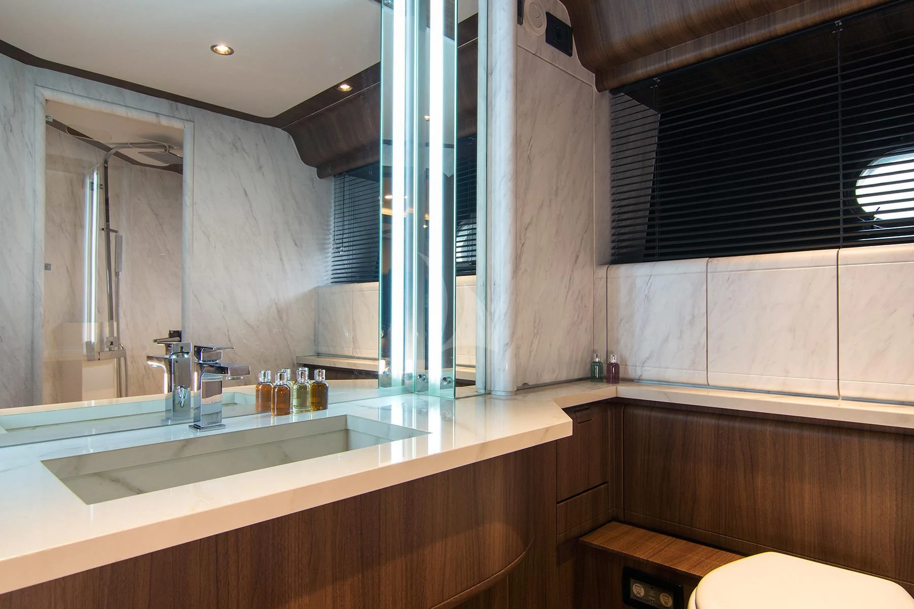 a bathroom with a sink and a window aboard OXYGEN 8 Yacht for Charter