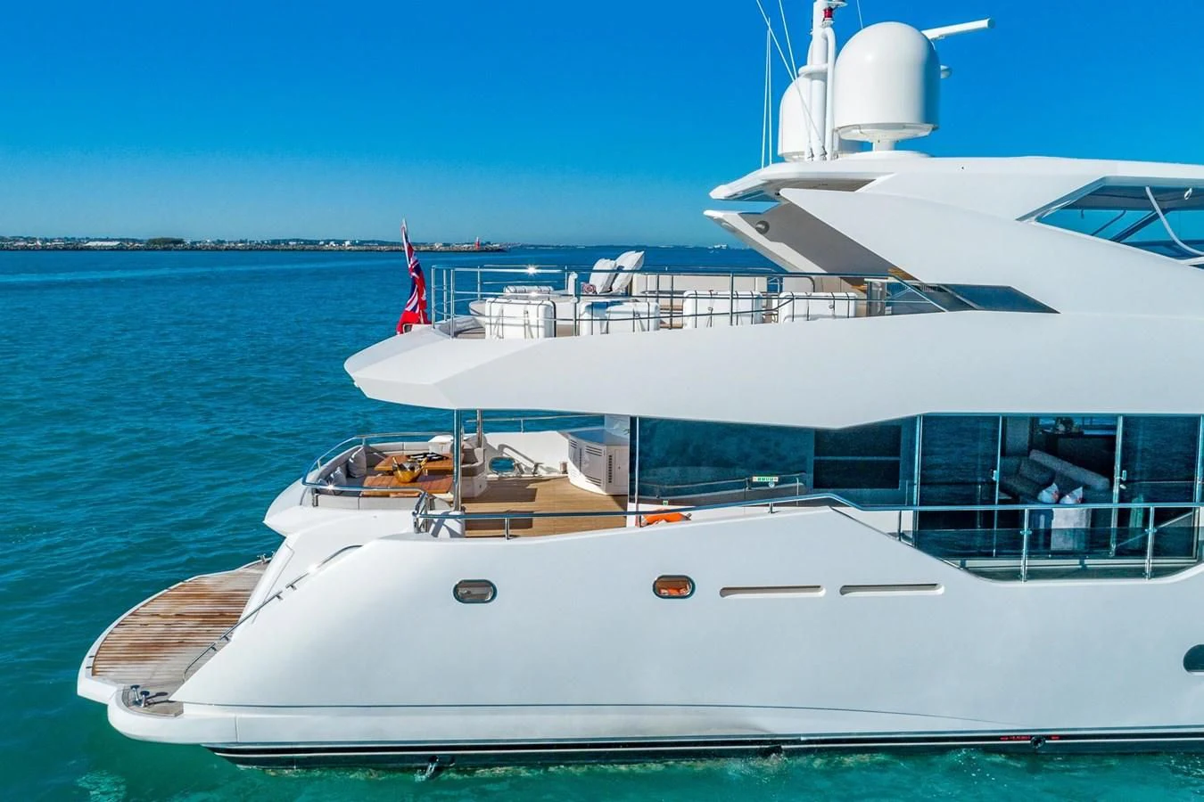 a white yacht on the water aboard SUNSET Yacht for Sale