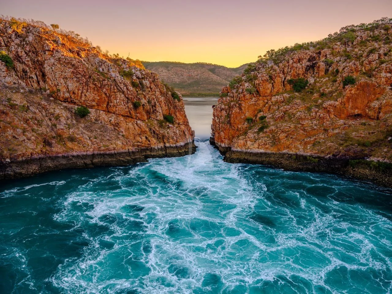 a body of water with rocky hills aboard SUNSET Yacht for Sale