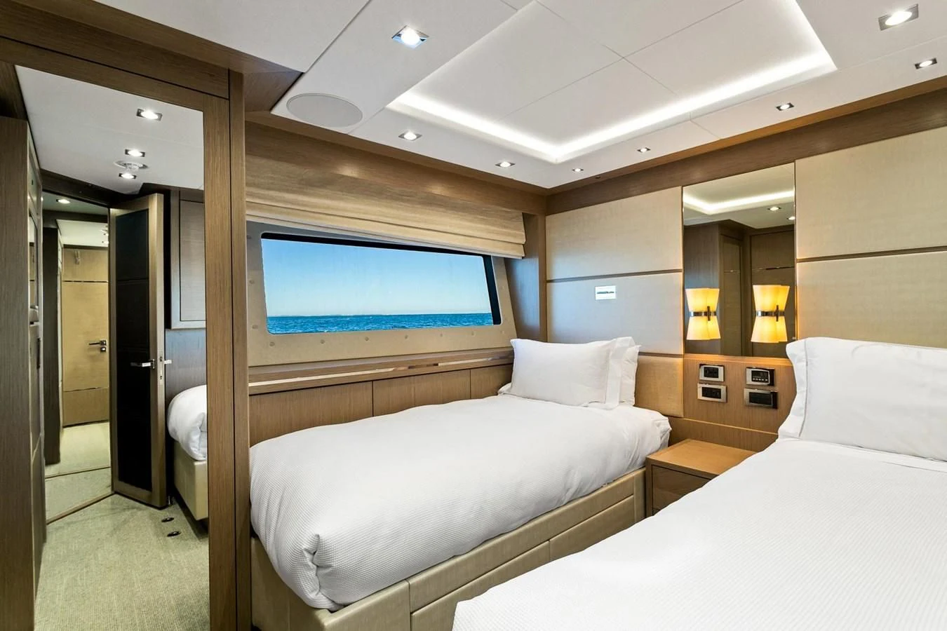 a room with a bed and a television aboard SUNSET Yacht for Sale