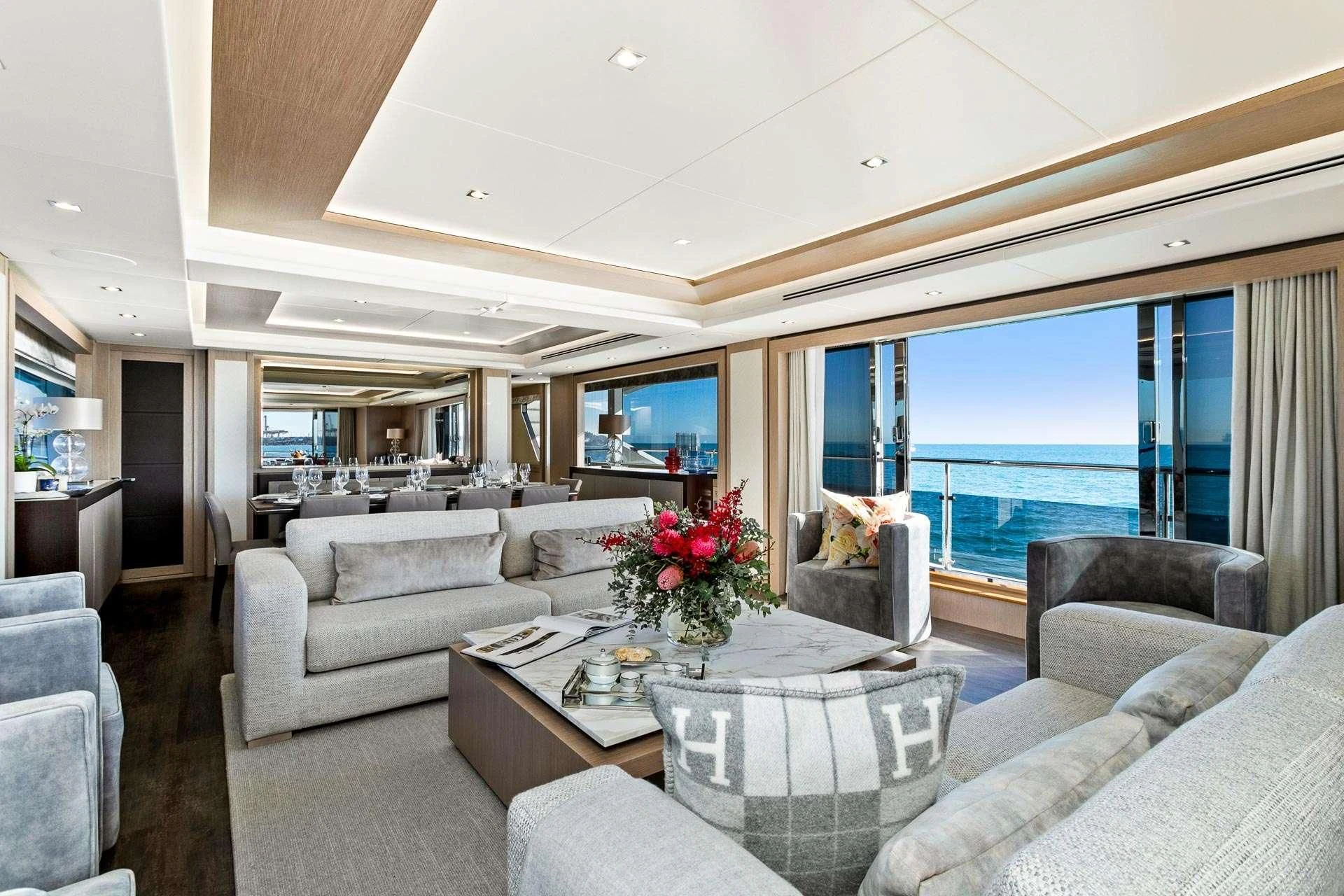 a living room with a large window aboard SUNSET Yacht for Sale