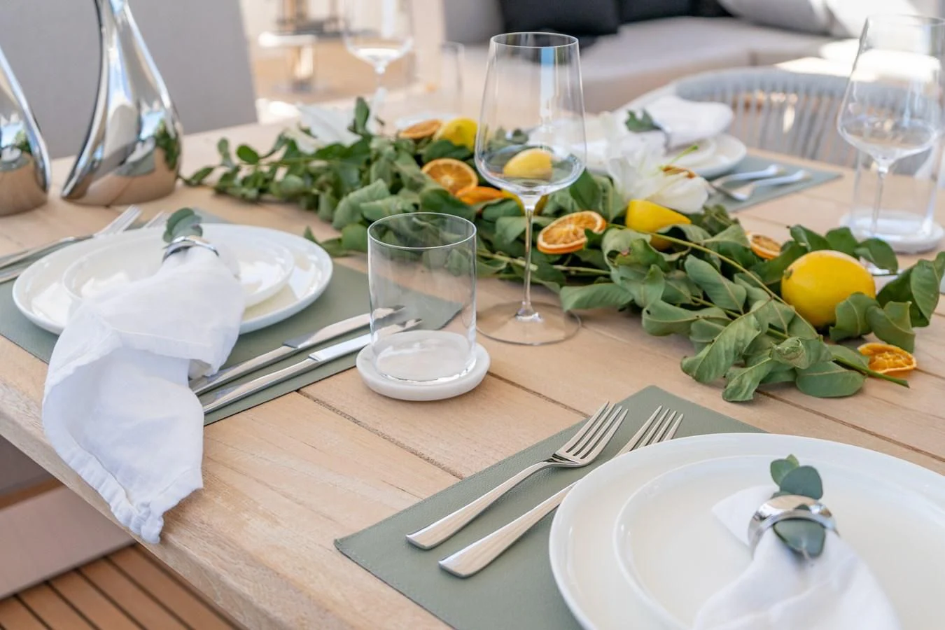 a table with plates and glasses aboard SUNSET Yacht for Sale