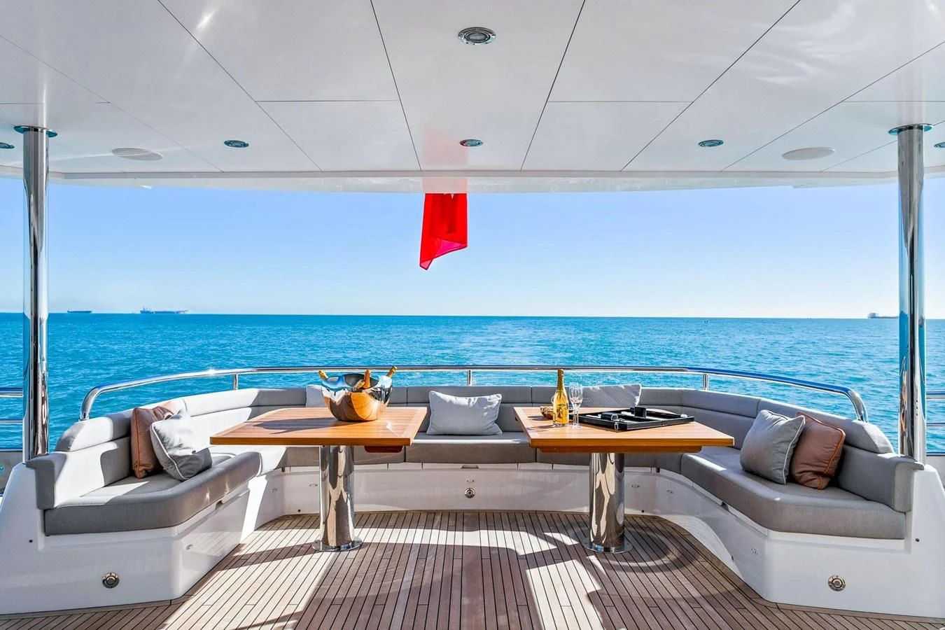a room with a table and chairs aboard SUNSET Yacht for Sale