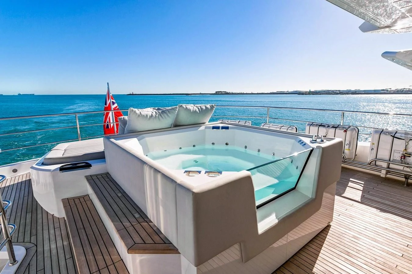 a pool on a deck overlooking the ocean aboard SUNSET Yacht for Sale