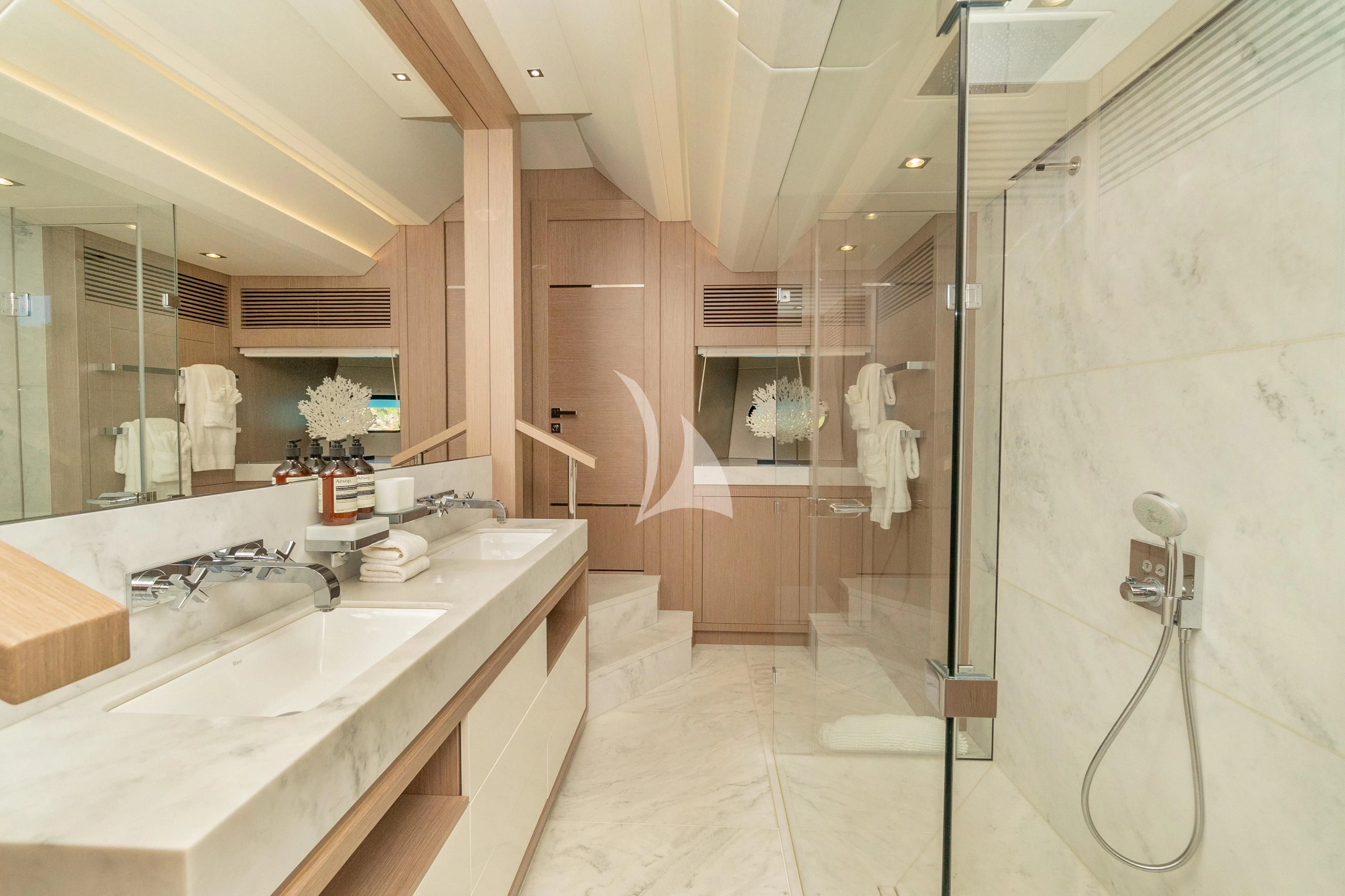 a bathroom with a shower and sink aboard SUNSET Yacht for Sale