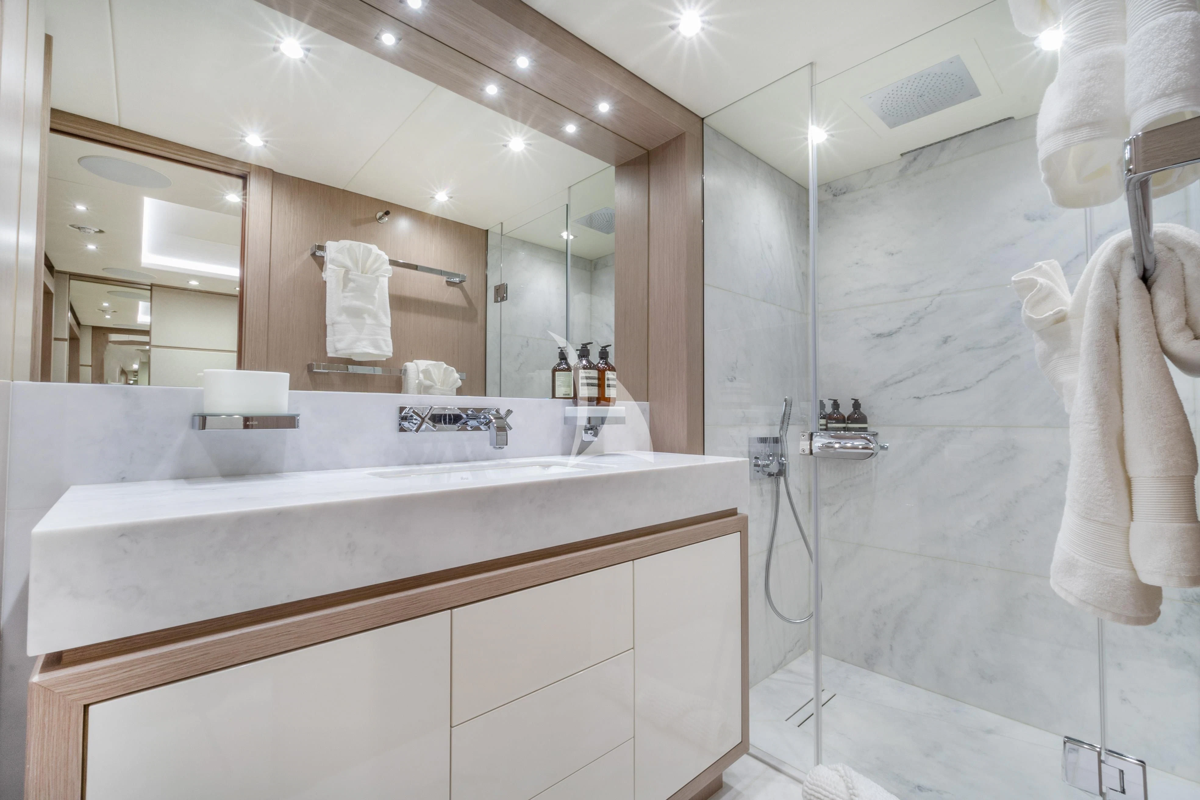 a bathroom with a large mirror aboard SUNSET Yacht for Sale
