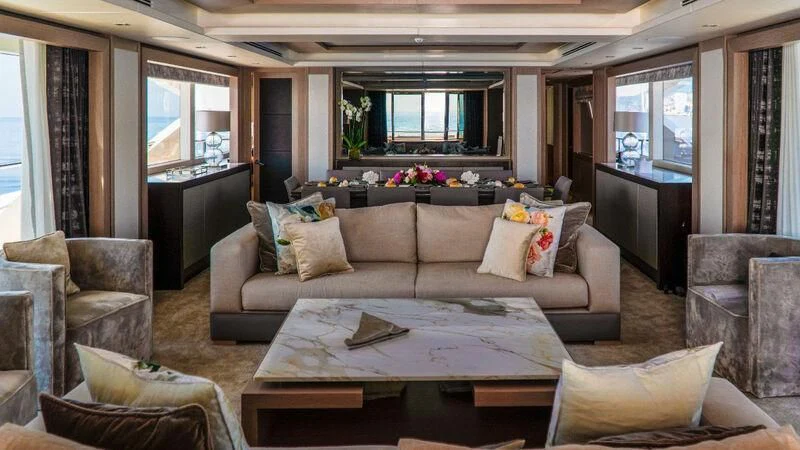 a living room with a couch and a coffee table aboard SUNSET Yacht for Sale