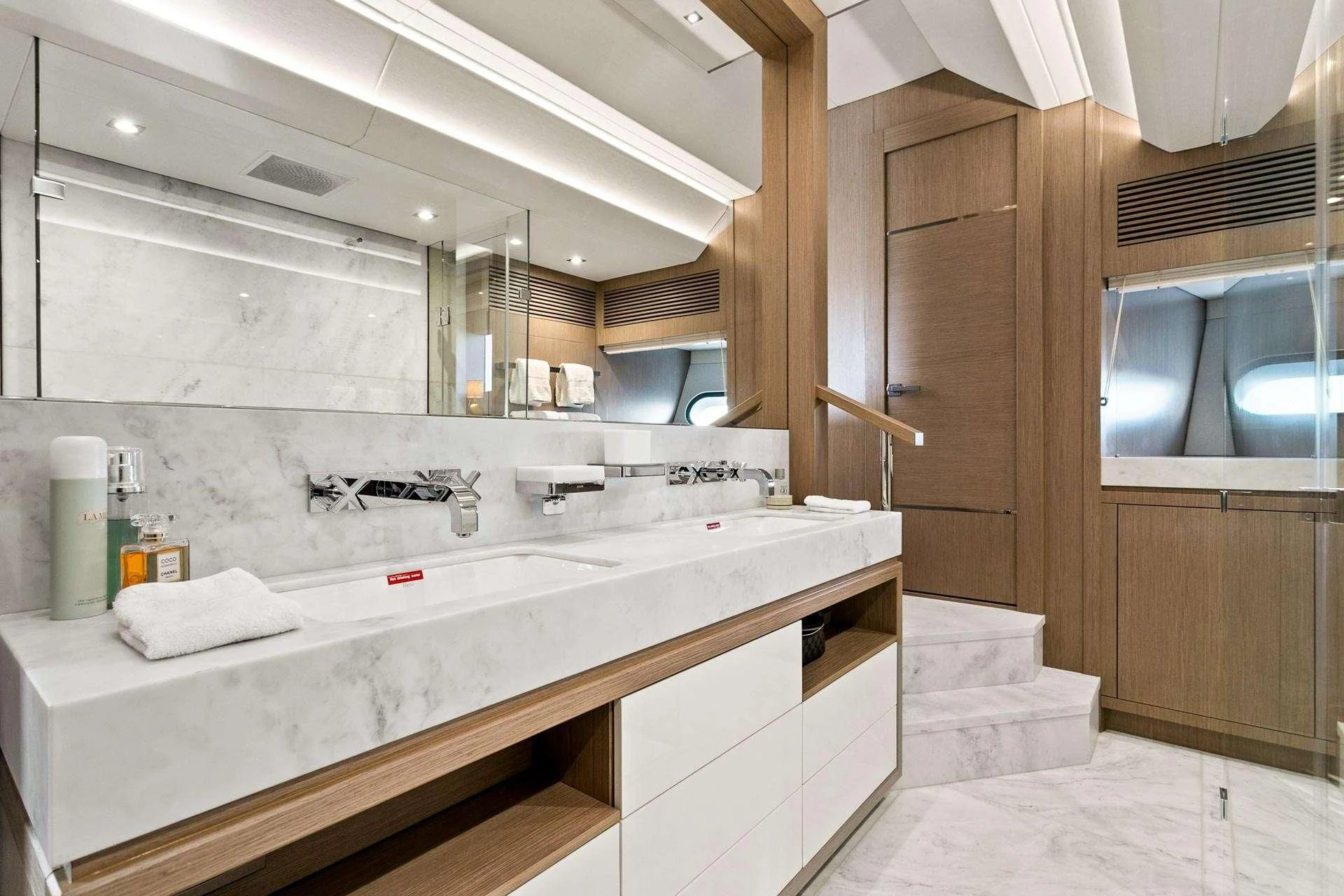 a bathroom with a sink and cabinets aboard SUNSET Yacht for Sale
