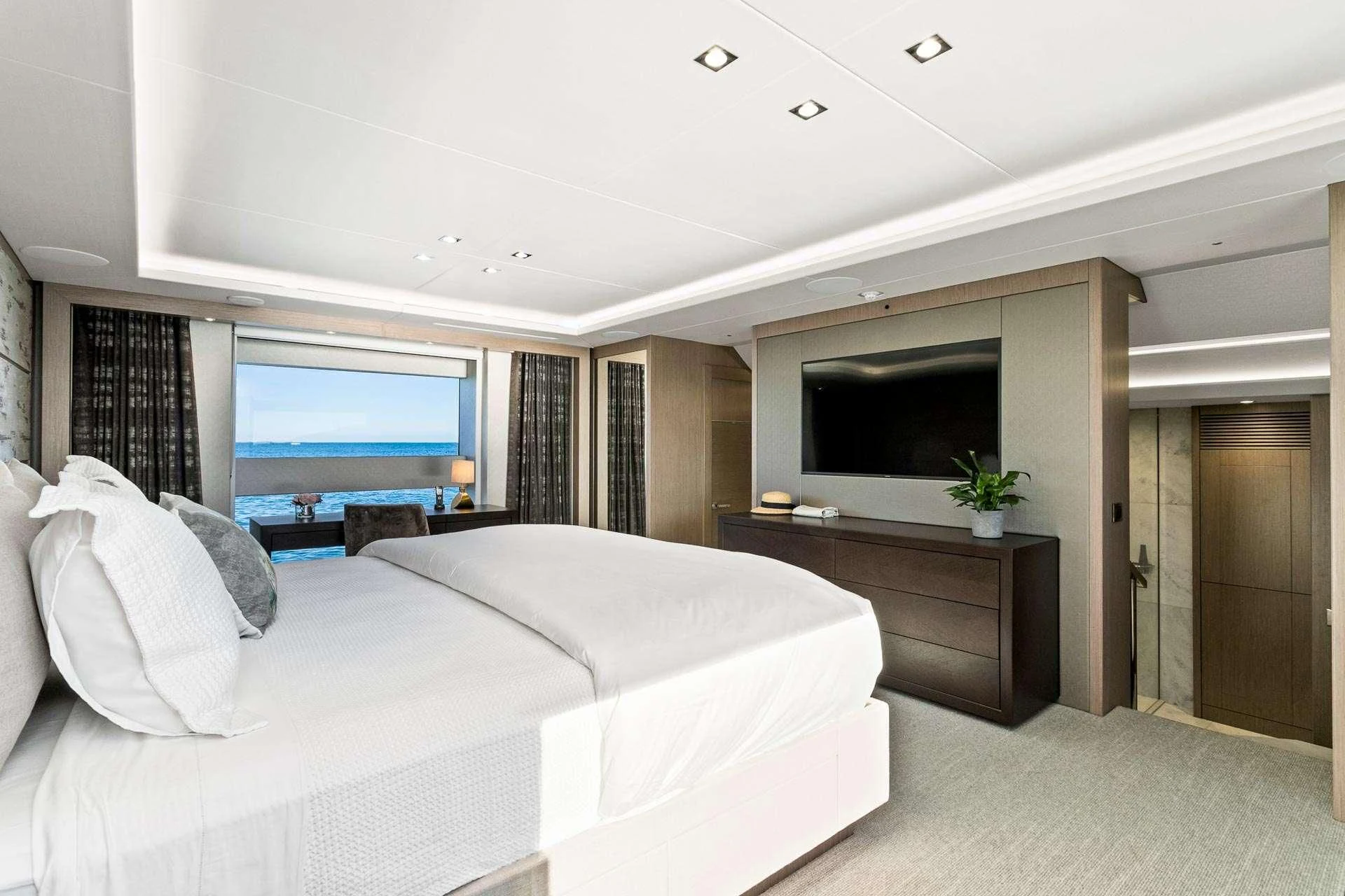 a bedroom with a large bed aboard SUNSET Yacht for Sale