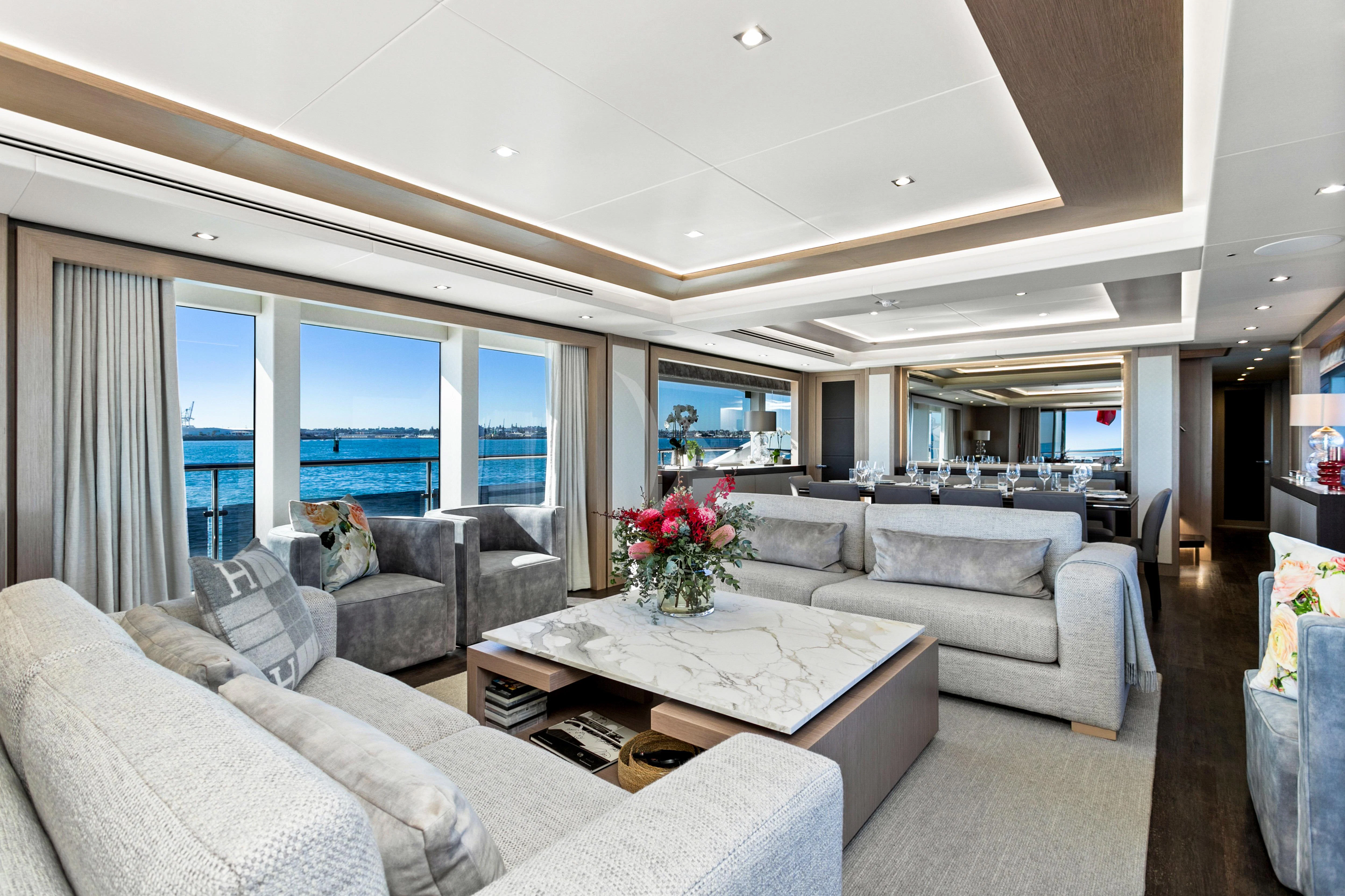 a living room with a large window aboard SUNSET Yacht for Sale