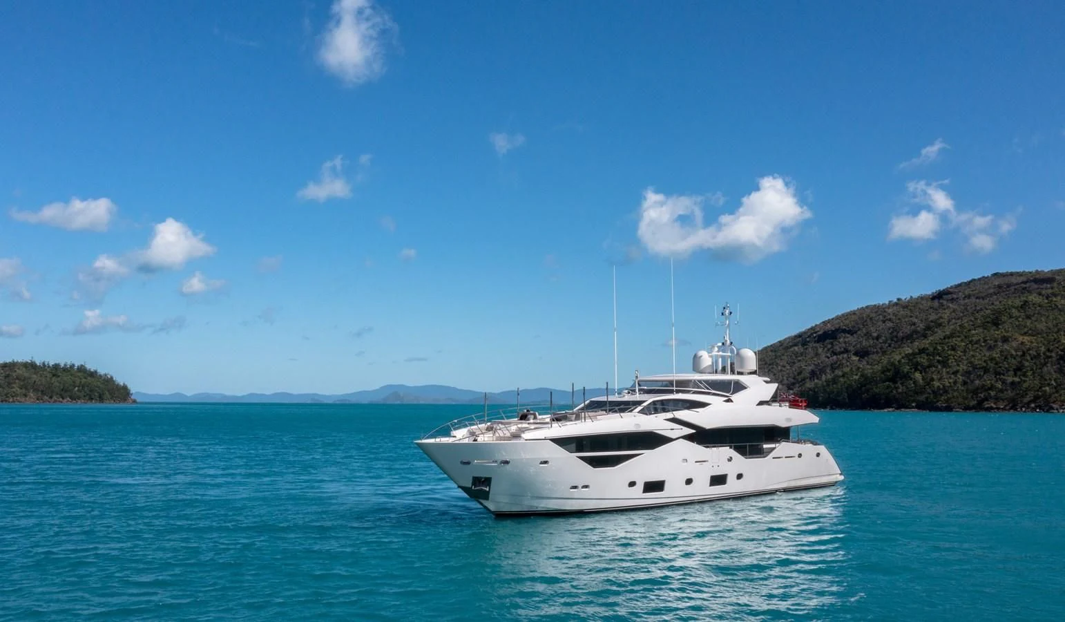 a white boat in the water aboard SUNSET Yacht for Sale