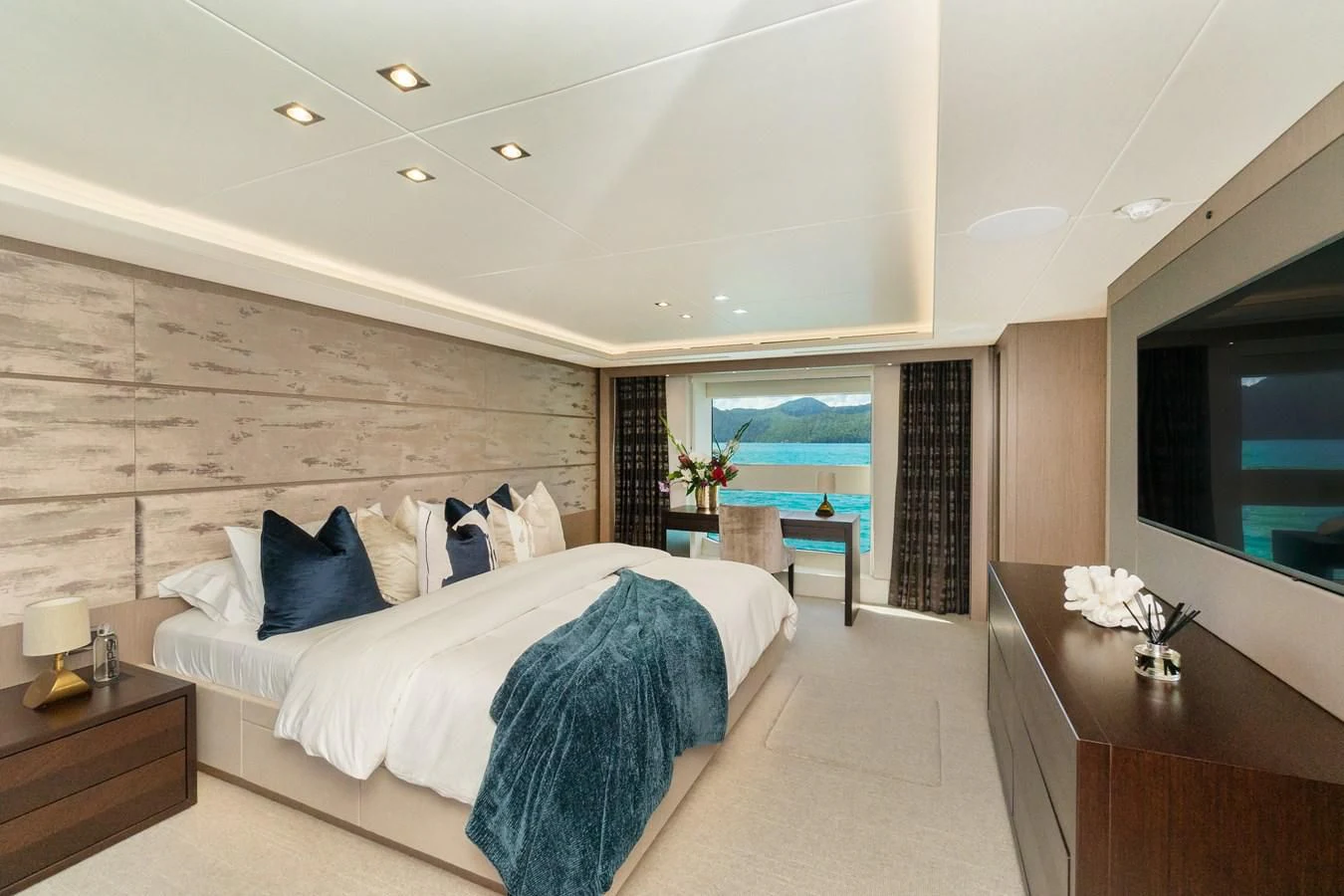 a large bedroom with a large bed aboard SUNSET Yacht for Sale