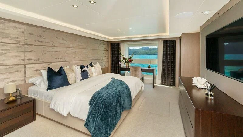 a large bedroom with a large bed aboard SUNSET Yacht for Sale