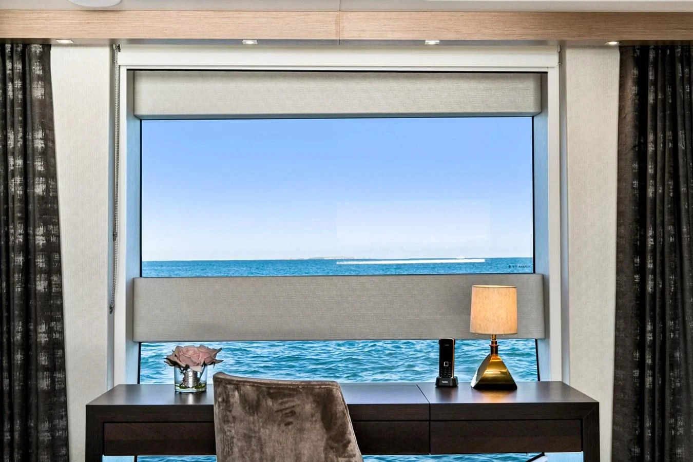 a room with a large blue screen aboard SUNSET Yacht for Sale