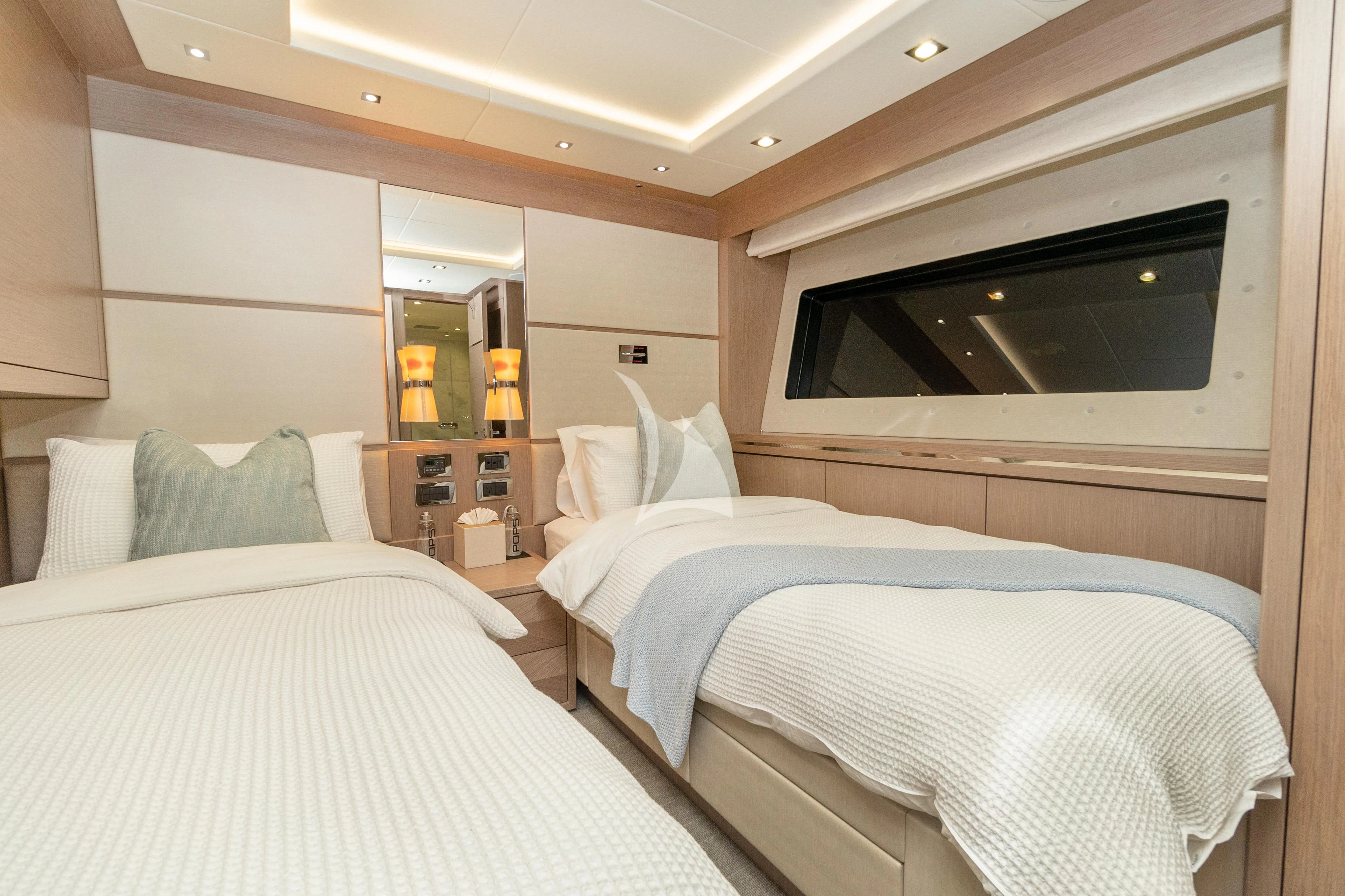 a room with two beds aboard SUNSET Yacht for Sale
