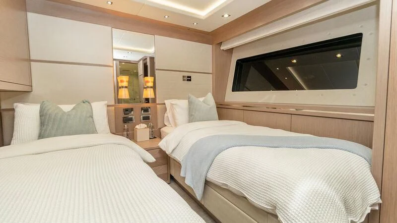 a room with two beds aboard SUNSET Yacht for Sale