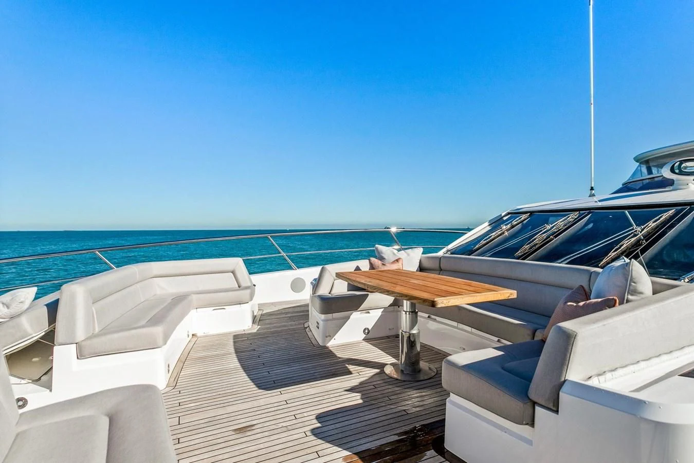 a boat dock with lounge chairs aboard SUNSET Yacht for Sale