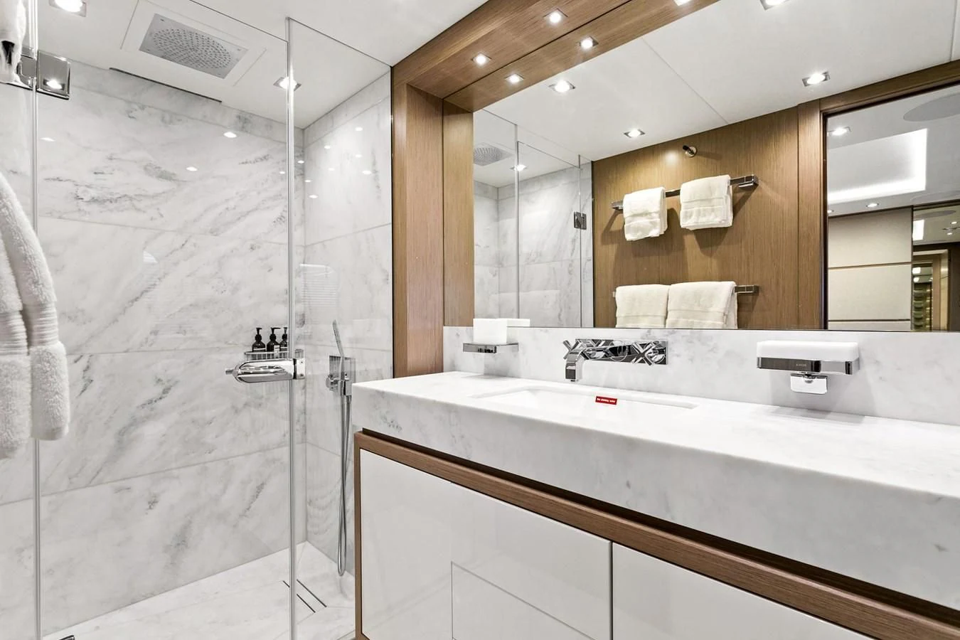 a bathroom with a large mirror aboard SUNSET Yacht for Sale