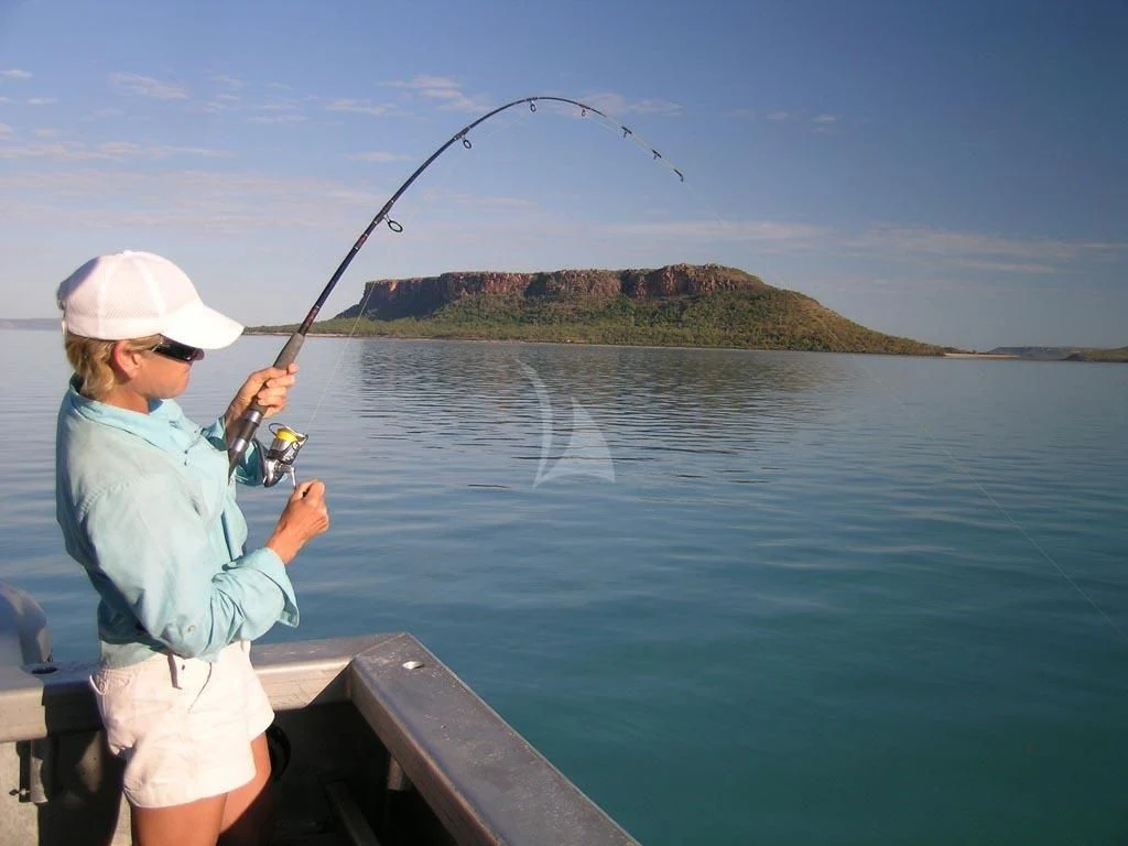 a person fishing on a dock aboard SUNSET Yacht for Sale